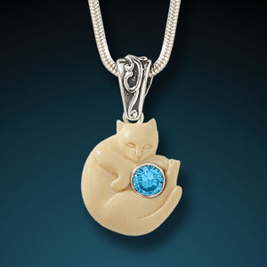 Fossilized mammoth ivory cat pendant with blue topaz - Cozy Cat